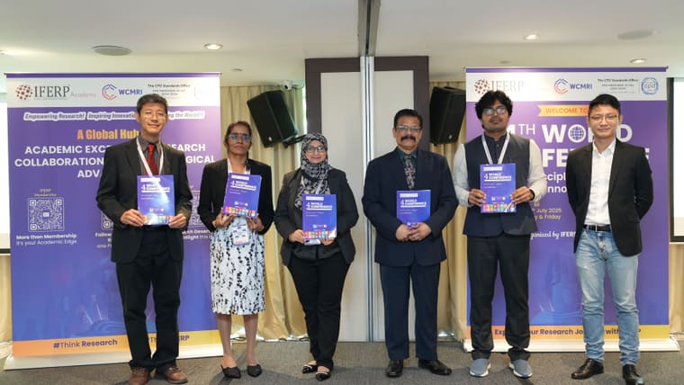 Delegates holding the printed proceedings at the 4th World Conference on Multidisciplinary Research & Innovation