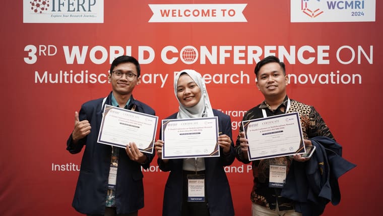 Three presenting authors holding certificates in front of the 3rd WCMRI conference backdrop